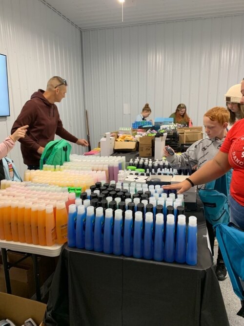 Just For Kids, a local charitable organization, lent a hand to help a group of teens fill packs of personal care items to give to Bay County teens in foster care.