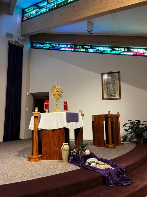 Sunlight streams in through stained glass windows near the rafters of the Adoration Chapel. (Photo courtesy of All Saints Parish)