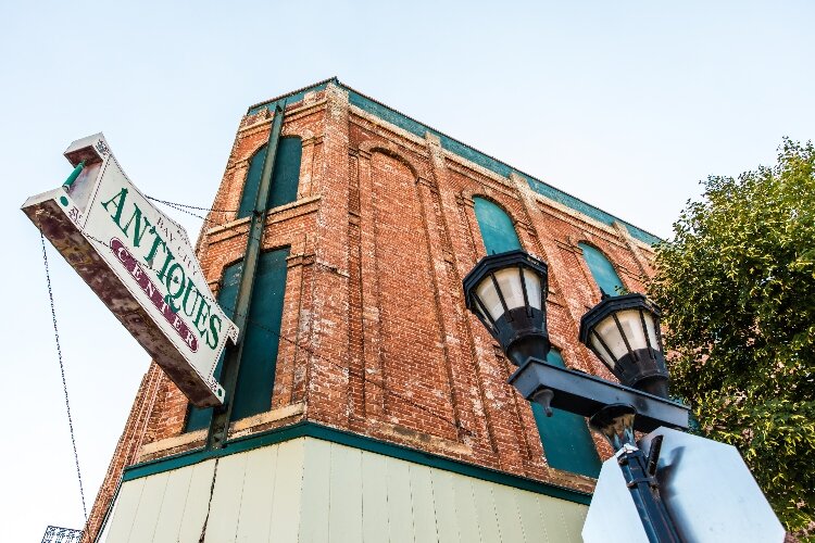 The corner of Third and Water streets, now home to the Bay City Antiques Store, St. Laurent Brothers, and Drift, was once the stomping grounds of legendary lumberjack Joe Fournier.
