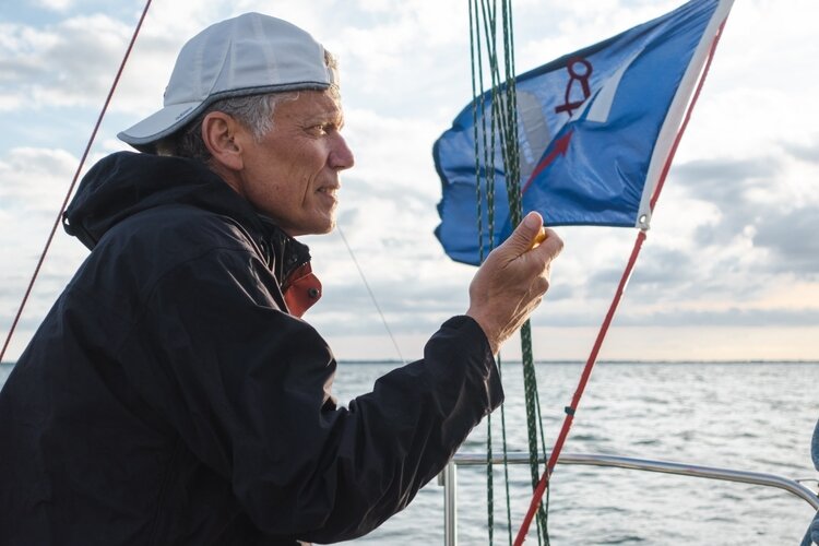 Sharon Kaye skipper Jim Ferency keeps track of race times during a recent Main & Jib race.