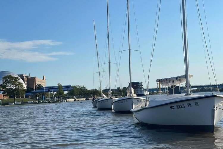 If you've seen the small white boats sailing across the river, you've seen the Saginaw Bay Community Sailing Association in action.