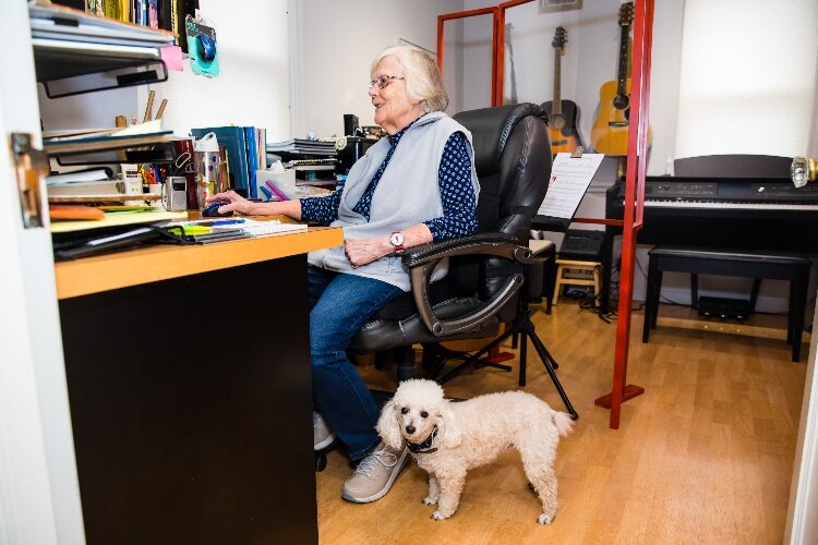 During lessons, Dexter, Harrigan's 10-year-old miniature poodle, can often be heard harmonizing from the living room of her west side Bay City home.