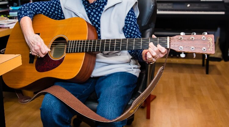 Harrigan saved enough money at 14 to buy herself a Gibson guitar. That same day, she taught herself to play a song.