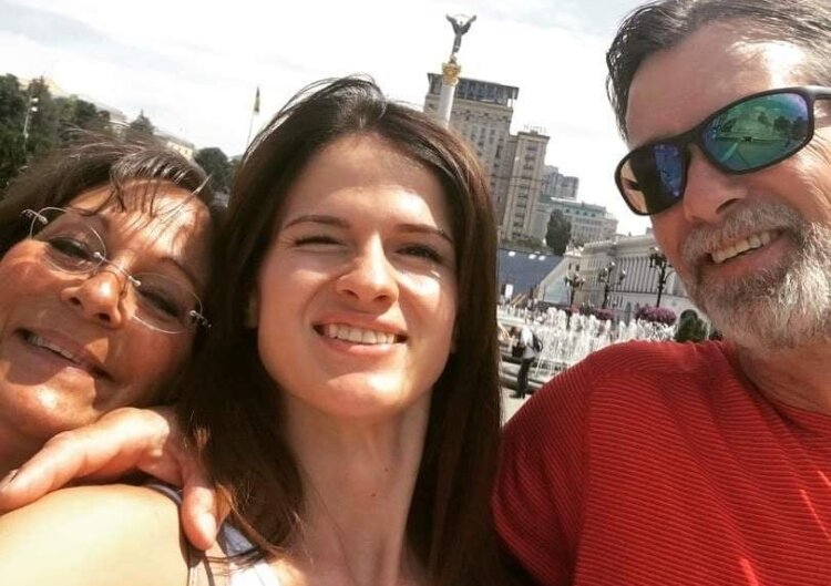 Luba Pavlovska poses with her American host parents, Matt and Gina Woods, in Kyiv a few years ago.