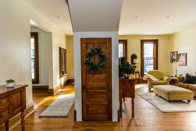 The family restored as much of the original flooring as possible. They also removed some original walls to improve the natural lighting. (Photo by Ashley Brown)