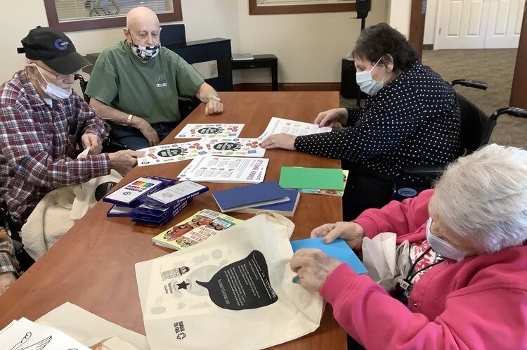 As part of the MLK Day of Service, volunteers filled bags with supplies for families to use together at home.
