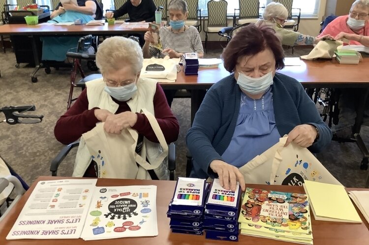 A book and craft supplies encouraged families to talk, read, and sing together to teach lessons about diversity and inclusion.