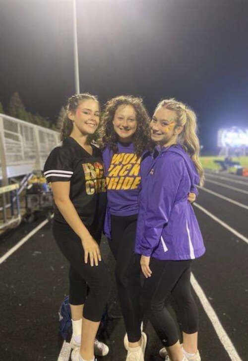 One of the Bay City Central cheerleading coaches says her athletes motivate her and inspire her to step outside her comfort zone.