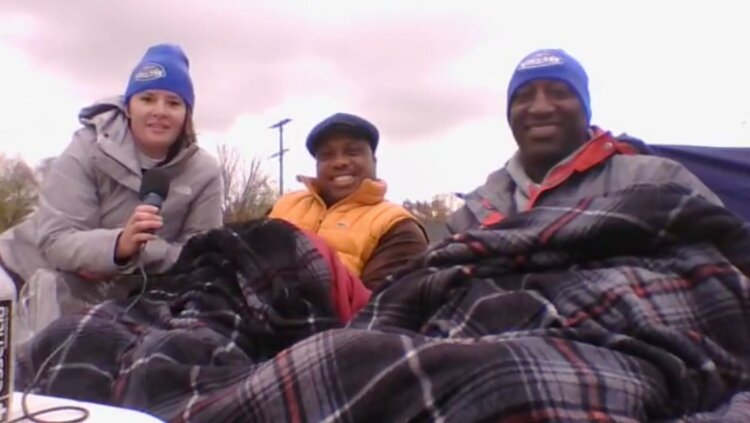 Several guests joined Rathke on the rooftop including Aland Stands, center, from River Jordan, and Brandon Murphy, right, from Bridge the Gap.