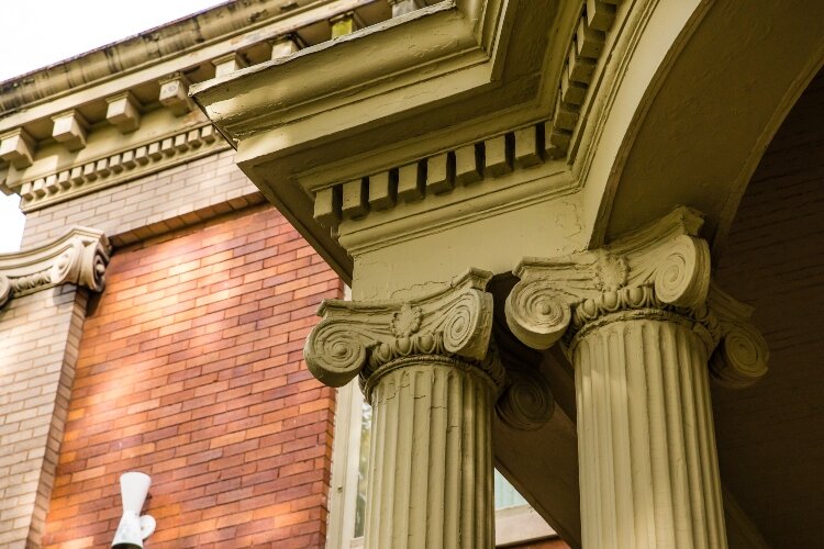 Grooved columns surround the main entrance to the home, which was turned into offices in 1964.
