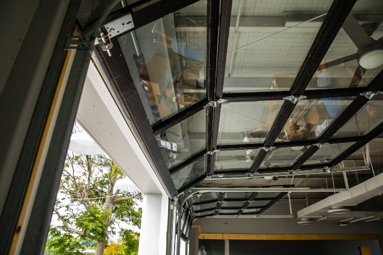 Open or closed, the roll-up doors connect the indoor and outdoor sections of the eatery.