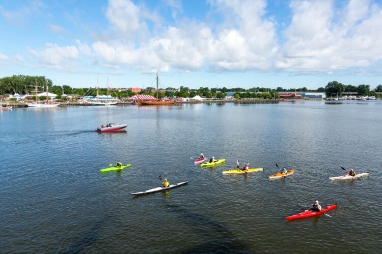 don’t have to own a power boat to get on the water. Float Paddle Center in Bay City lets you rent a kayak or paddle board. These kayakers were watching the Tall Ship Celebration in 2019. (Photo courtesy of Go Great Lakes Bay.)