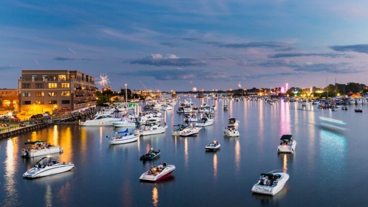 Bay City’s well-known fireworks festival returns in 2021. One of the best viewing spots for the show is from a boat in the Saginaw River.  (Photo courtesy of Great Lakes Bay CVB)
