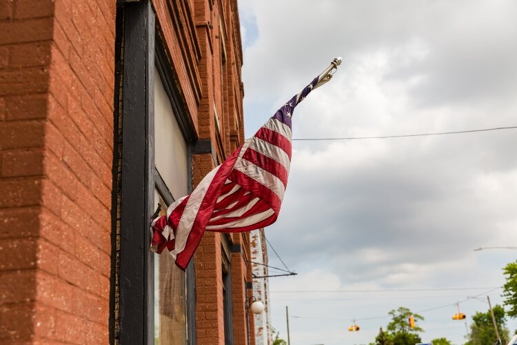When you’re driving along M-25 in Michigan’s Thumb, take notice of the little details, such as backyard gardens and porches decorated with flower baskets and flags. (Photo Credit: Ashley Brown)