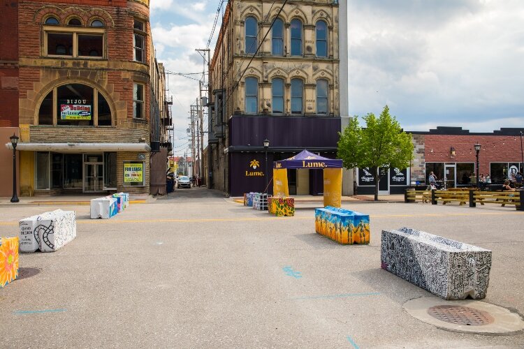 Decorated concrete blocks mark one section of Feet on the Street district in Downtown Bay City.