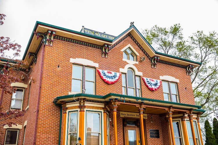 In 1876, James Shearer designed and built this two-story brick home for his son and daughter-in-law. The home was next door to James Shearer’s 701 Center Ave. home.