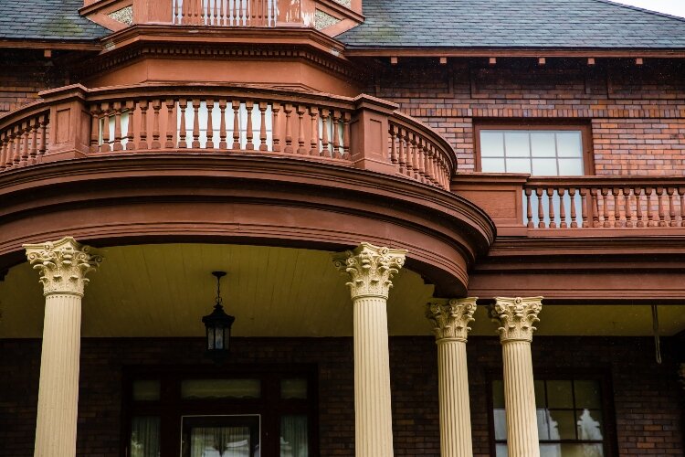 The home includes a Romeo and Juliette balcony with an attic dormer. 