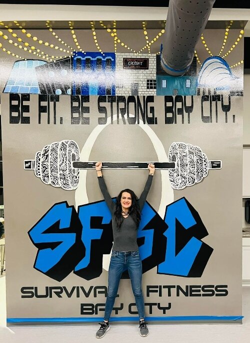 Nicole McKay created a mural inside Survival Fitness that has become a popular backdrop for post-workout selfies and group photos. (Photo courtesy of Survival Fitness)