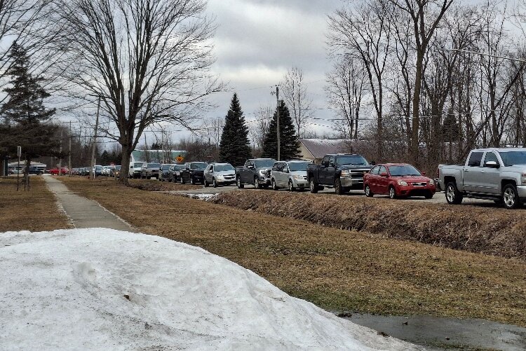 Long lines outside the distribution point – the Boys & Girls Clubs of Pinconning – highlighted the growing need for community support.