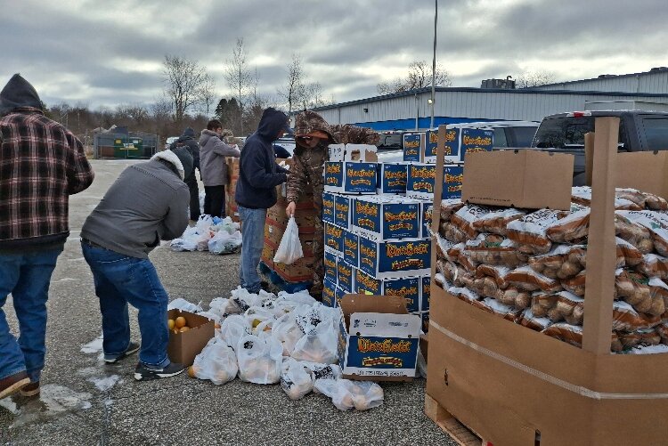 ​​​​​​​Volunteers handed out canned goods, fresh fruits, vegetables, and other essential items, working through the day to keep up with demand.