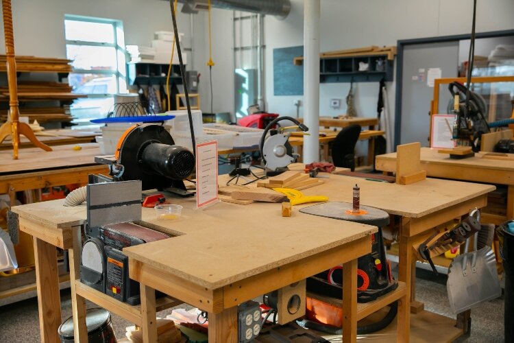 Recently, the center began adjusting equipment so it can be raised and lowered, making it easier for people in wheelchairs or on stools to work.