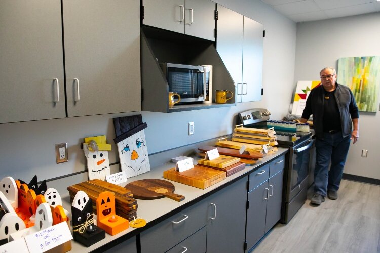 More handmade wooden crafts fill the counters of a kitchen inside the center.