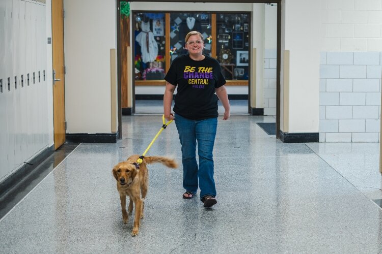 Loiselle walks Pippa through the halls as she greets students and staff.