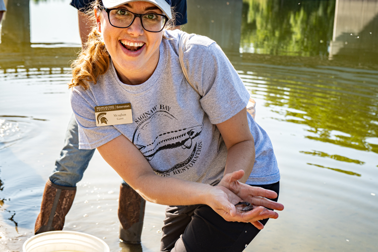 Meaghan Gass, Michigan Sea Grant Extension Educator with MSU Extension, at an earlier sturgeon release event. (Photo Credit: Alyssa German)