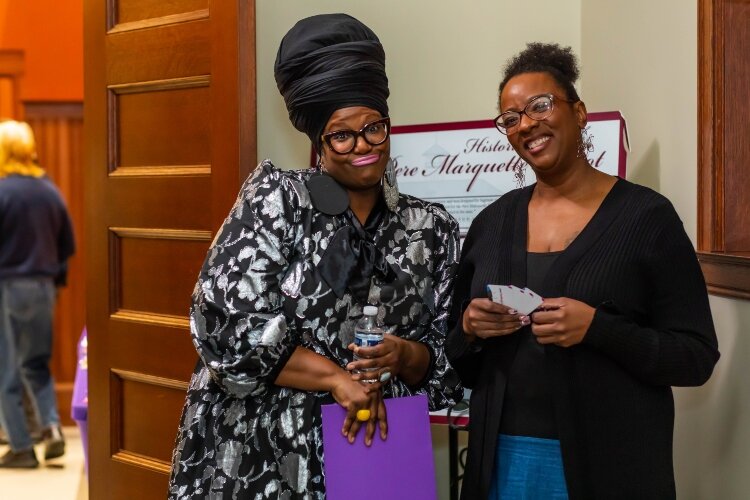 Before the live show, Breaking Bread Founder Erin Patrice mingles with the audience.
