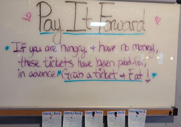 At the Broadway Family Grill, customers can buy a meal for someone in need. The pay-it-forward board is just one way the restaurant tries to serve the community.