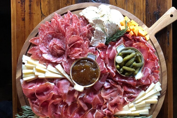 Prost owners Zak and Korina McClellan opened the Bay City location of Prost! Wine Bar & Charcuterie in November of 2022. (Photo courtesy of Prost! Wine Bar & Charcuterie)